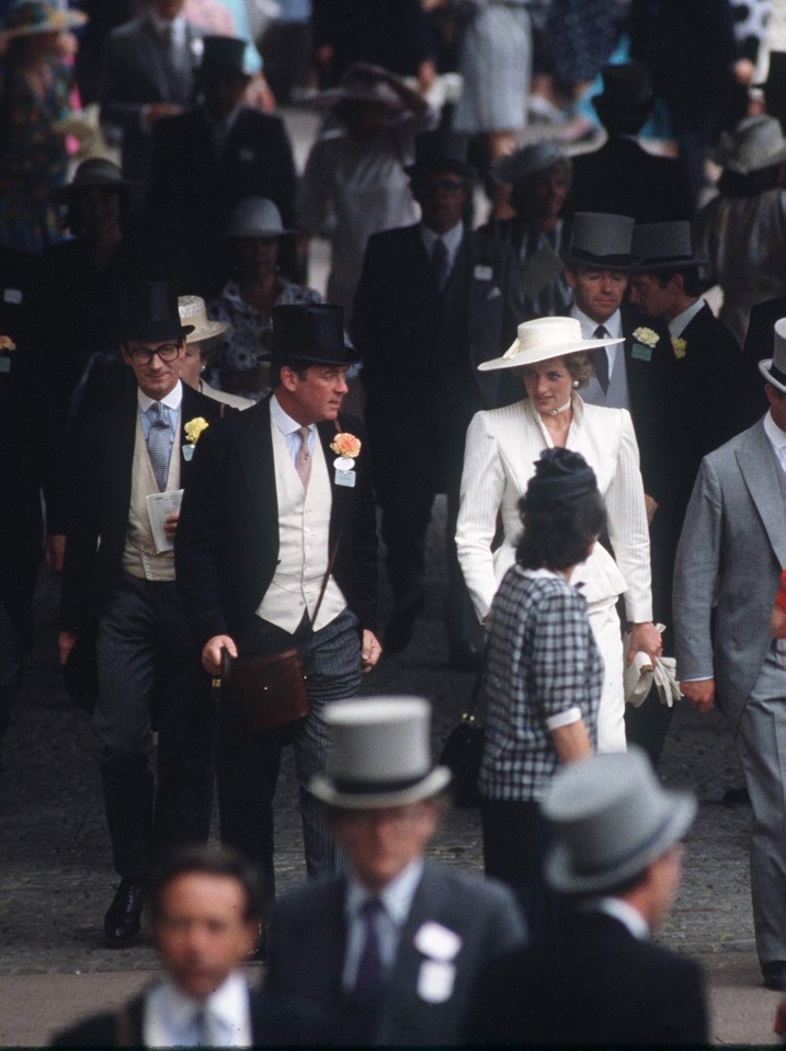 a crowd of people wearing top hats are walking down a street