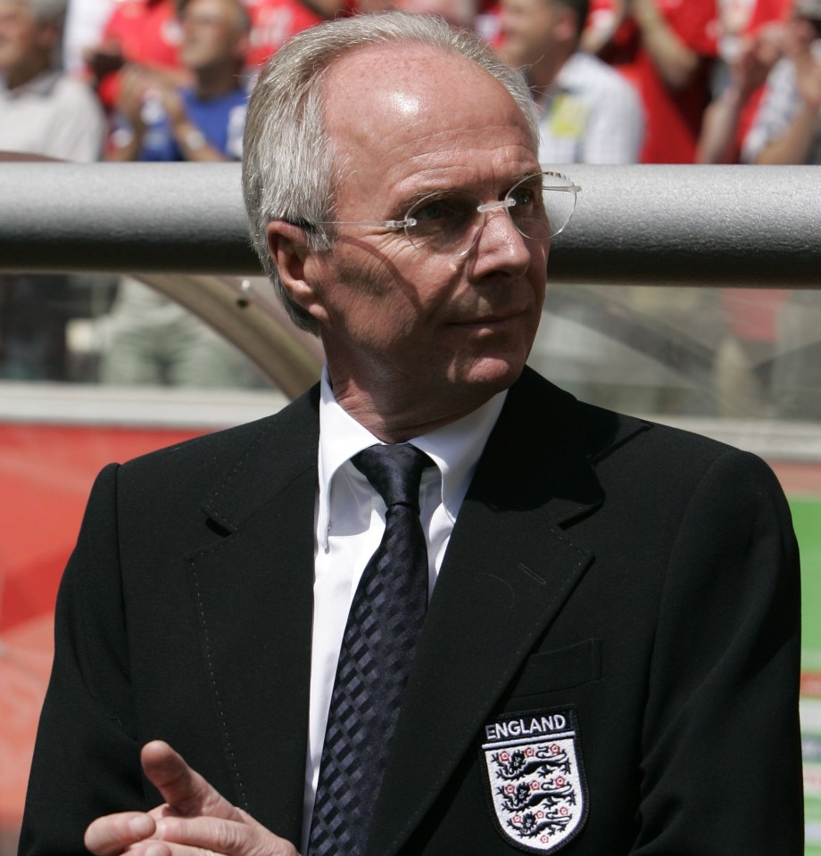 a man in a suit and tie has a patch on his jacket that says england