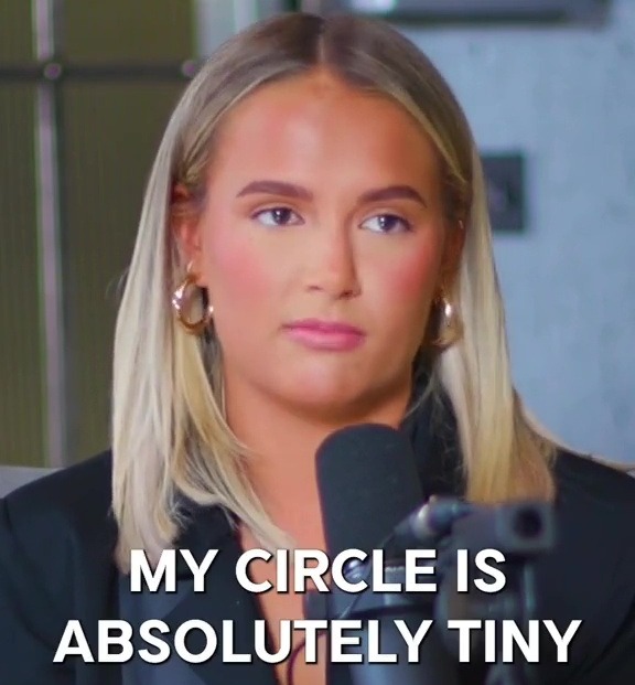 a woman in front of a microphone with the words " my circle is absolutely tiny does molly mae have friends "