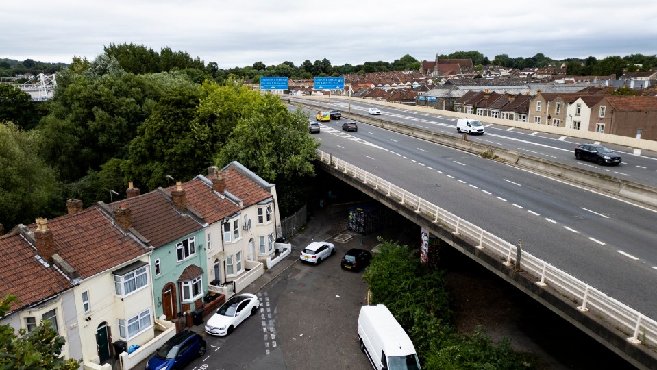 an aerial view of a highway with a blue sign that says a1