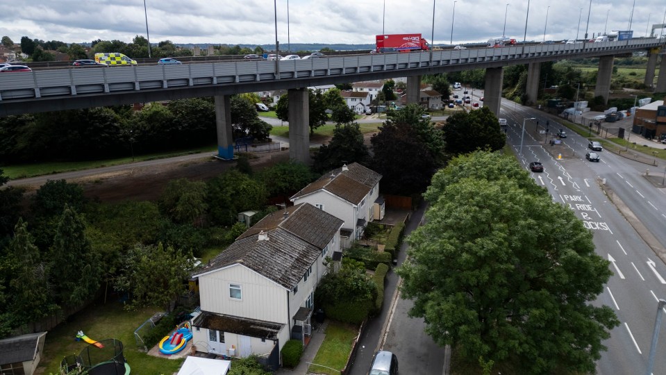 an aerial view of a highway with a red coca cola truck in the background