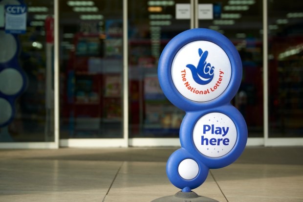 a blue and white sign for the national lottery