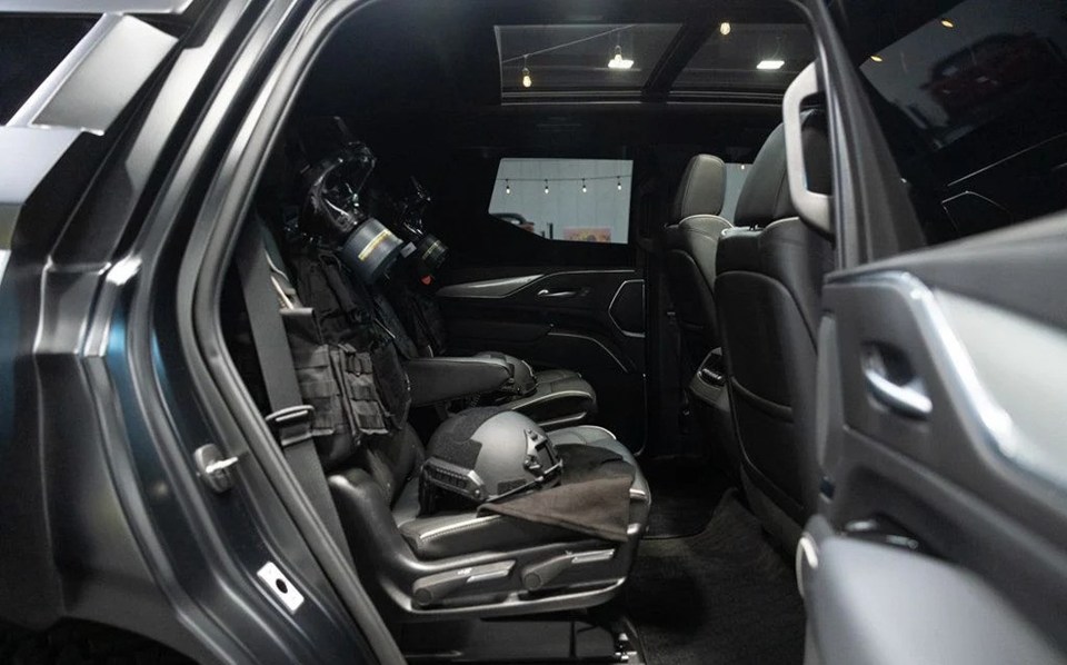 a helmet sits in the back seat of a car