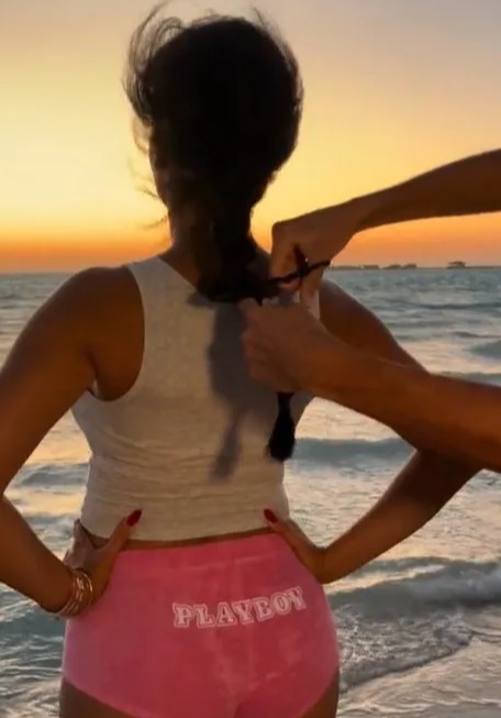 Georgina had some of her hair cut off in front of the ocean