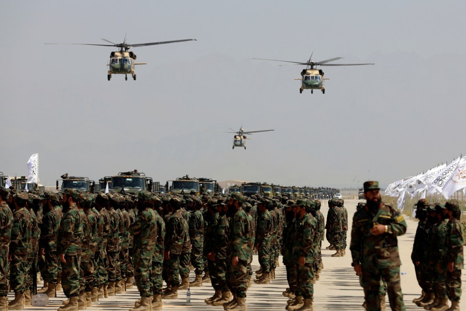 Taliban show off UH-60 Black Hawk helicopters fly during the military parade