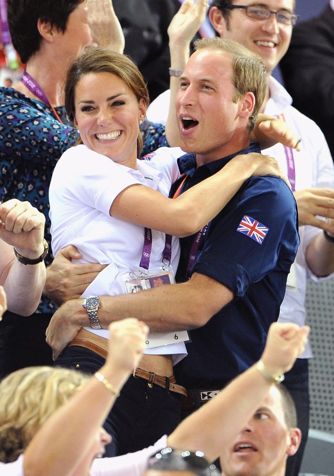 a man with a british flag on his shirt is hugging a woman