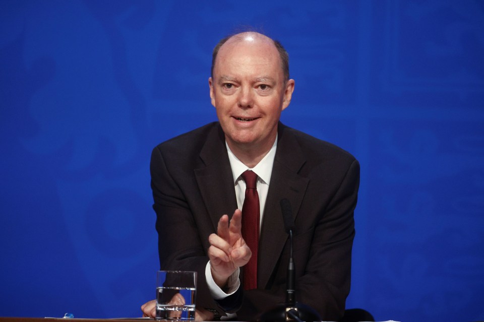 a man in a suit and tie is giving a speech