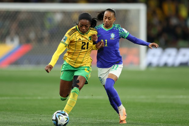 a woman in a yellow jersey with the number 21 on it