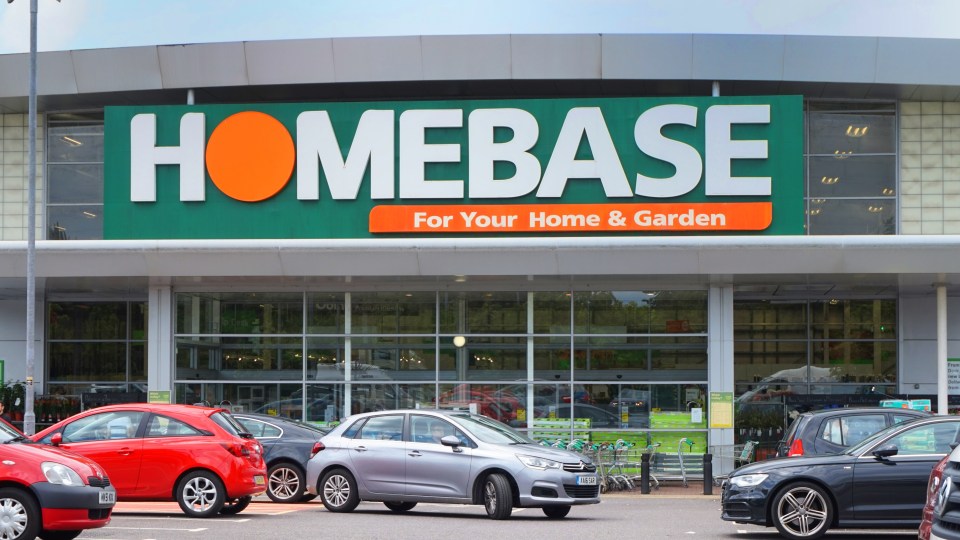 a homebase store with cars parked in front of it