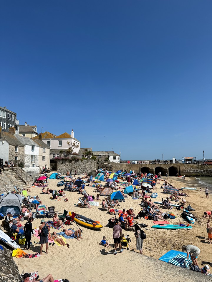 Crowds of holidaymakers enjoy the sunny day on the popular beach in St Ives (file image)