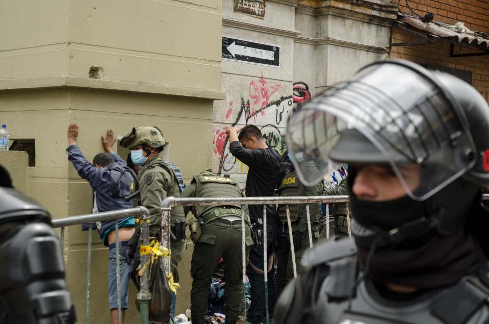 a police officer with the word policia on his uniform