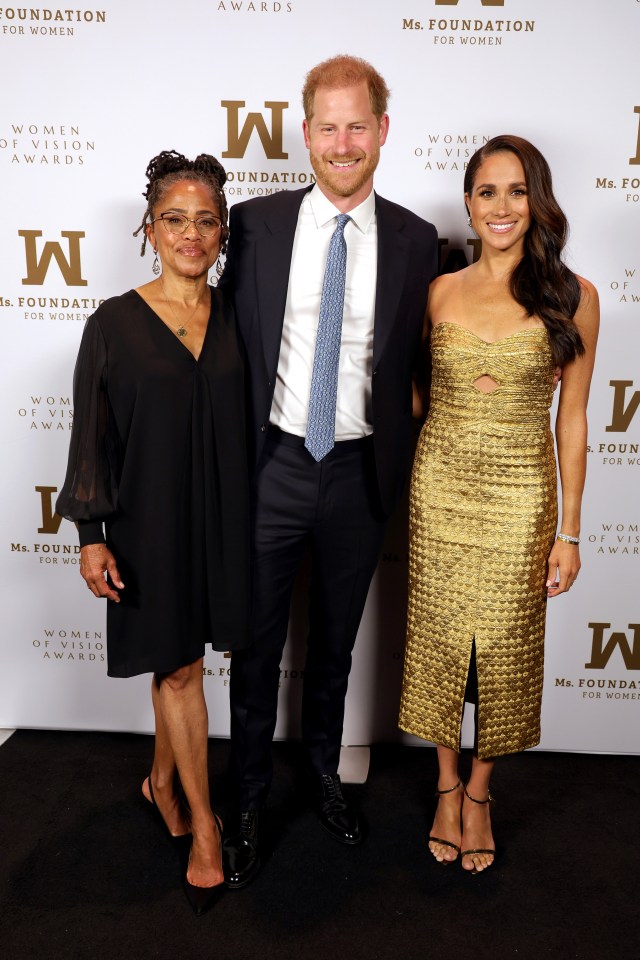 Meghan looked sensational as she accepted the award wearing a tight-fitting Johanna Ortiz golden dress, and was accompanied by Prince Harry and mum Doria Ragland