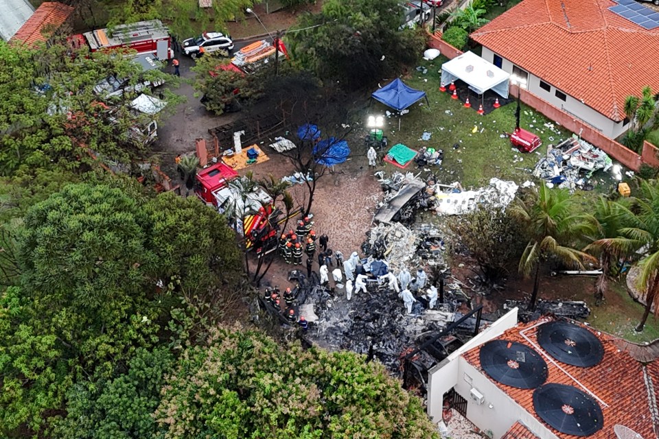 an aerial view of a residential area with a fire truck in the background