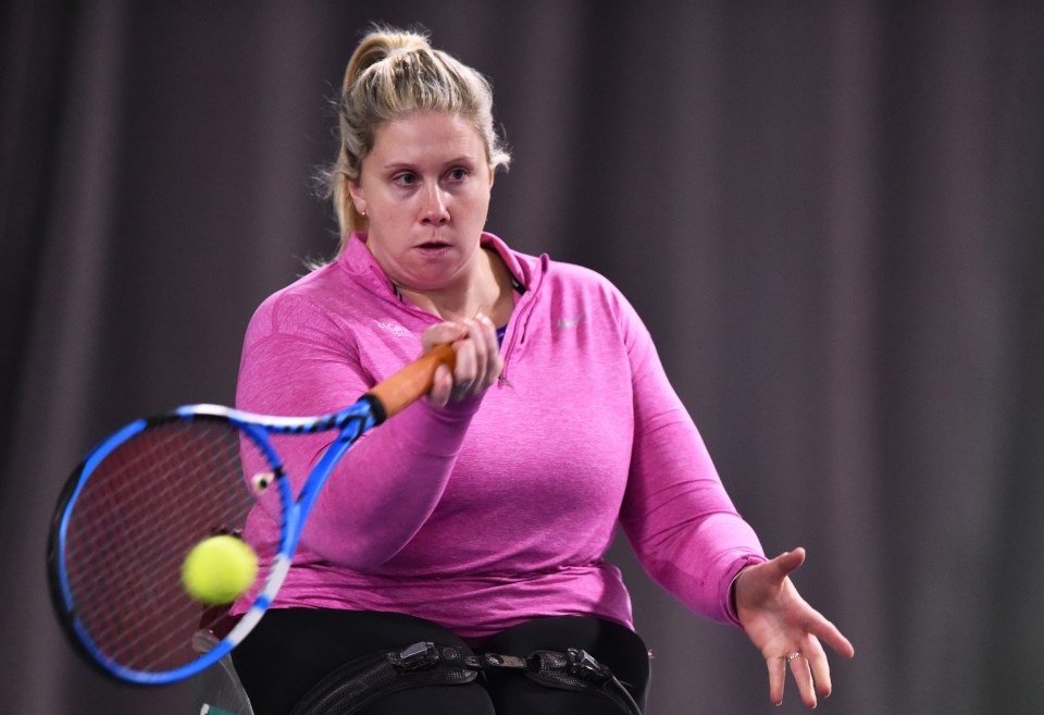 a woman in a pink shirt is playing tennis