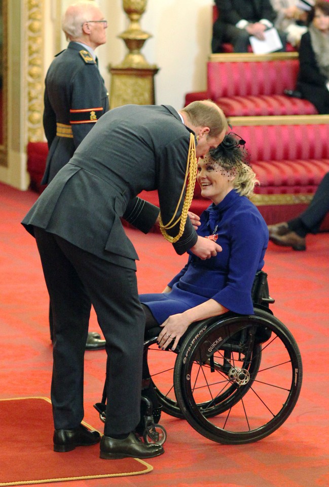 Claire being presented with an MBE by Prince William in 2017