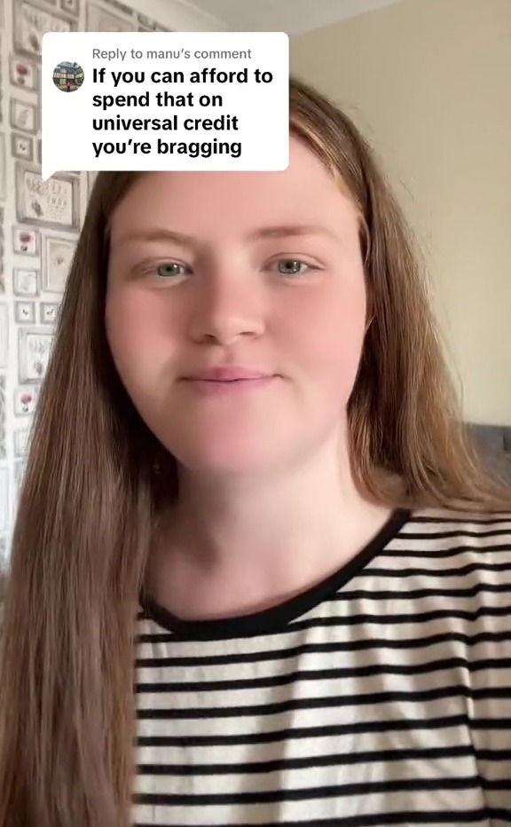 a woman with long hair is wearing a striped shirt and smiling .