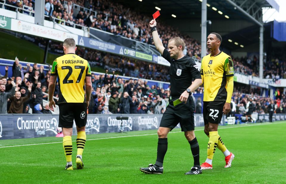 Adam Forshaw saw red in the first half for two cynical yellow cards