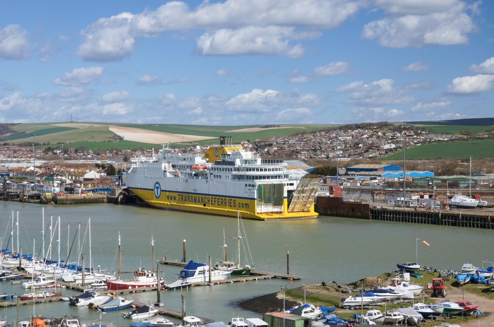 a large yellow and white ship with the website www.transandferries.co.uk on the side