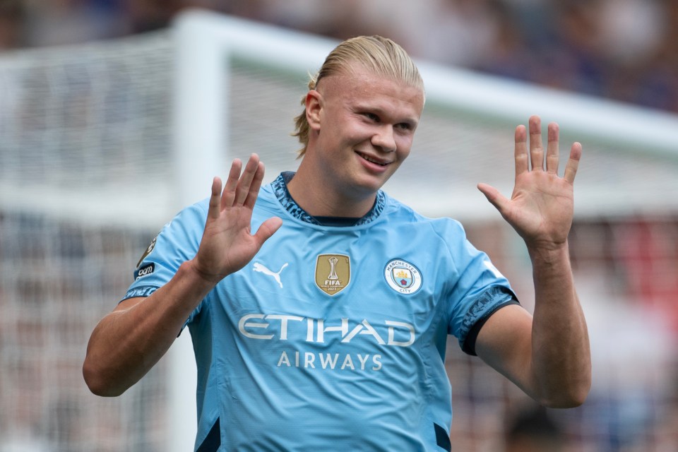 a soccer player wearing a blue etihad airways jersey