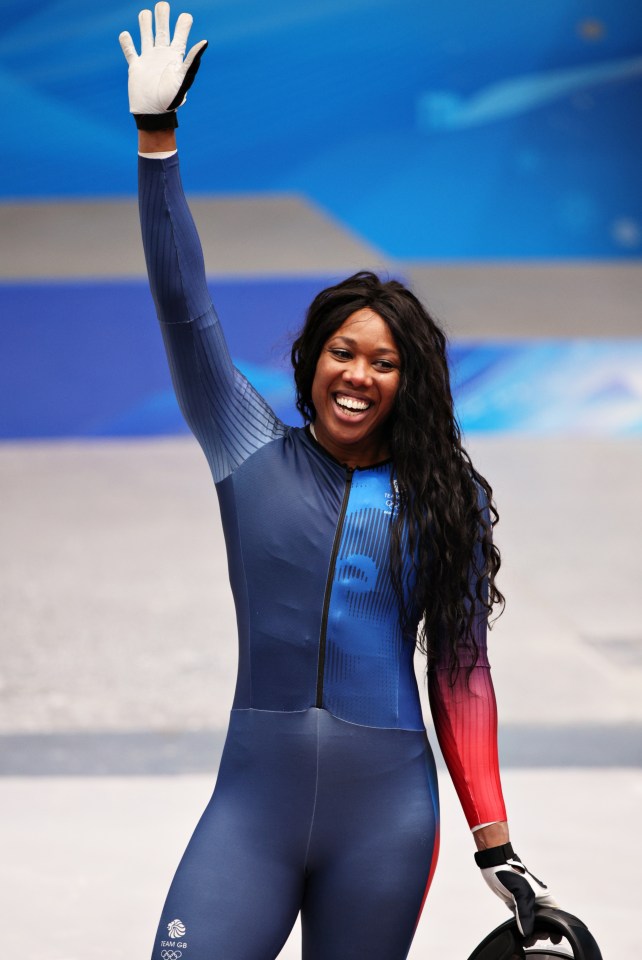 a woman in a blue and red suit with the word great britain on it