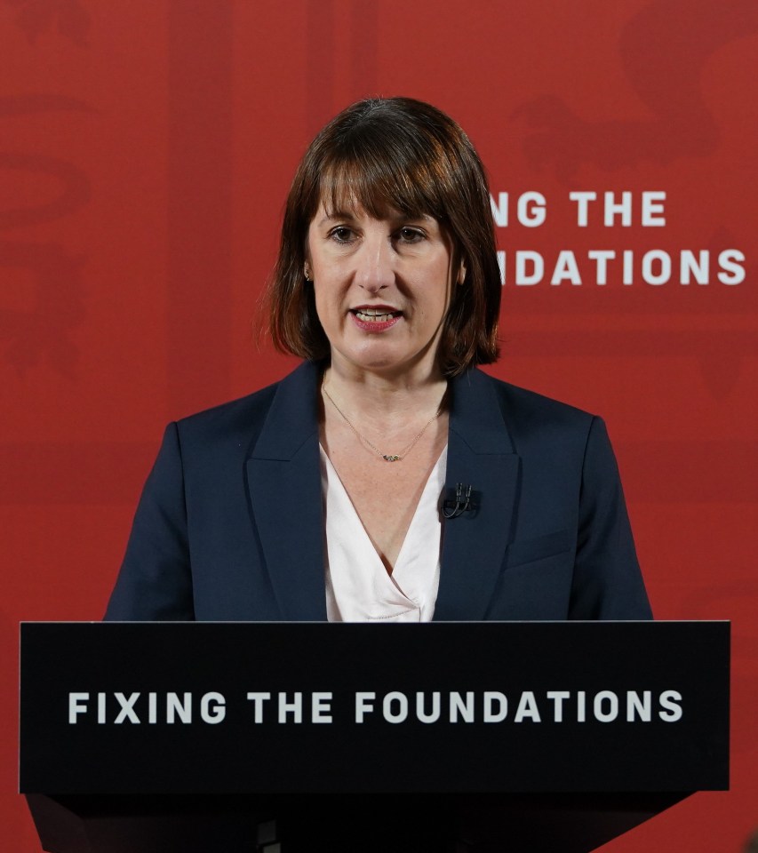 a woman stands at a podium that says fixing the foundations