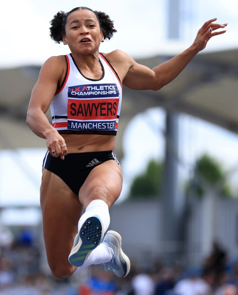 a female athlete named sawyers is jumping in the air