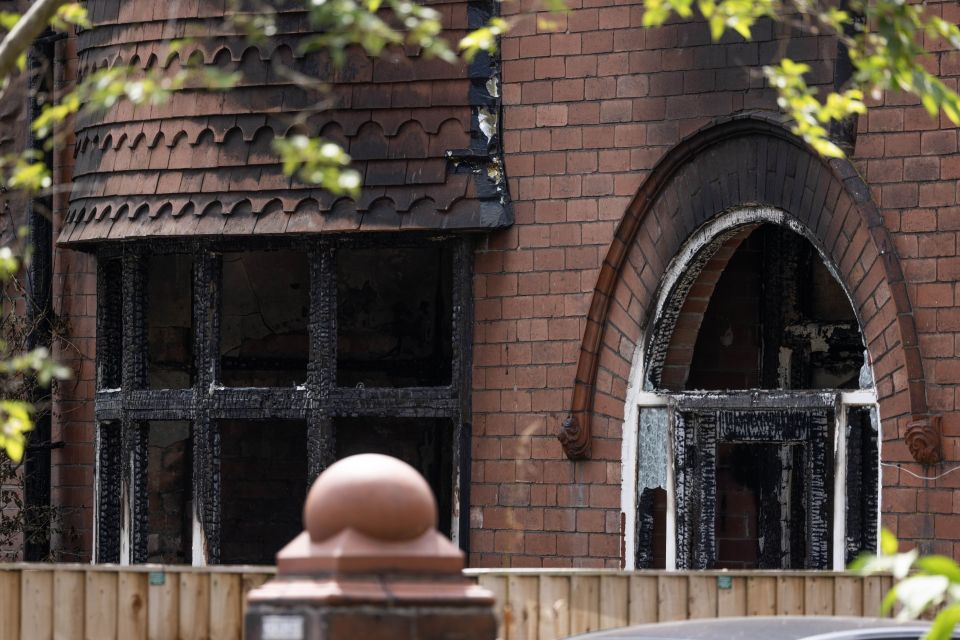 A charred window at a home in Chorlton