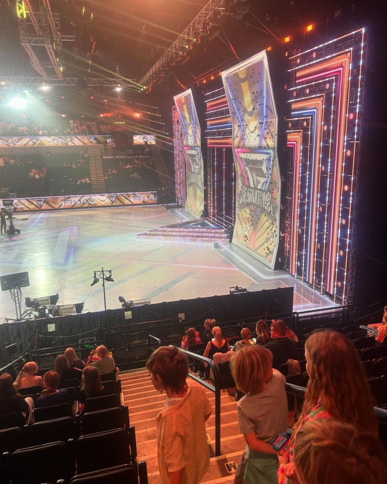 a group of people sitting in front of a stage that says america 's got talent