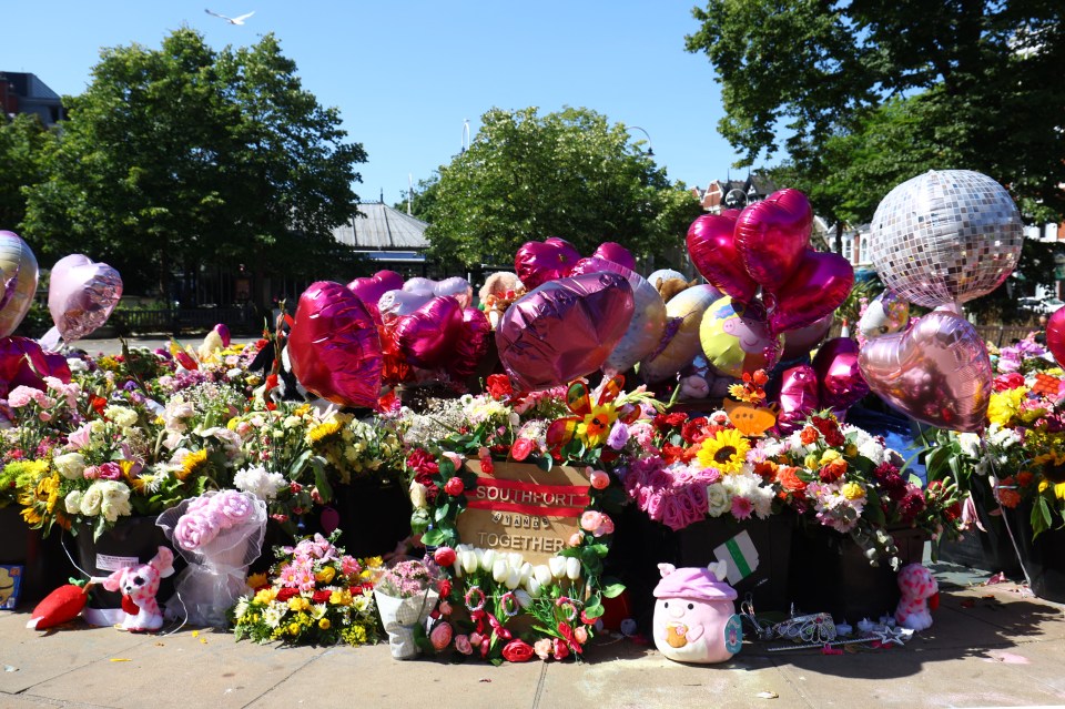 a bunch of flowers and balloons with a sign that says south australia kisses together