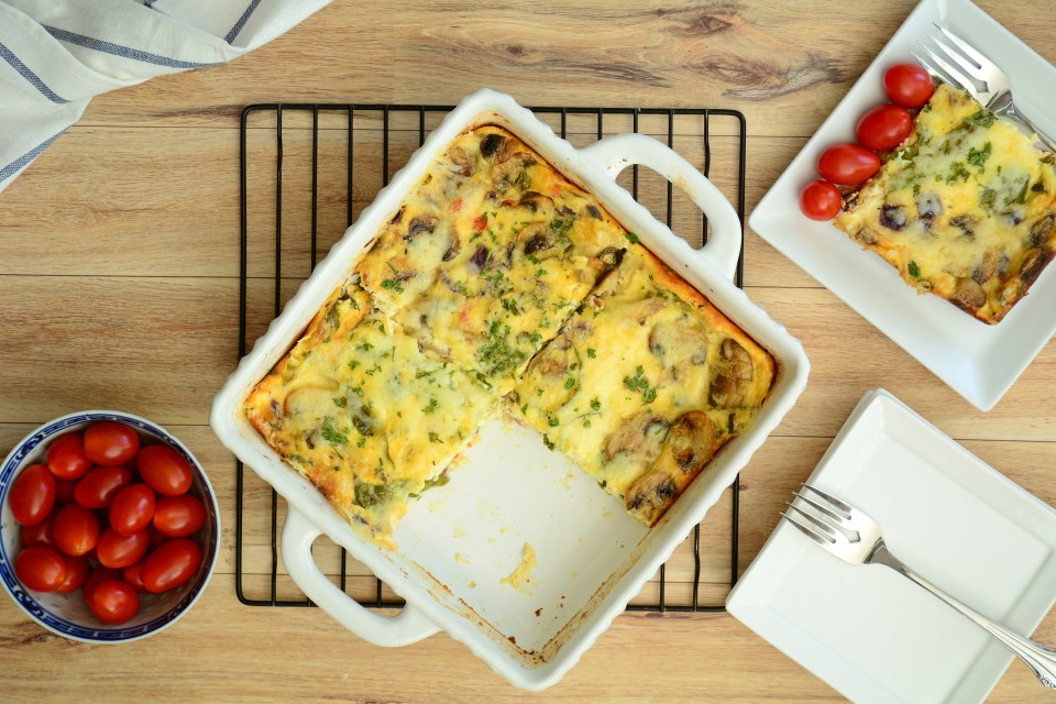 a casserole dish with a slice taken out of it