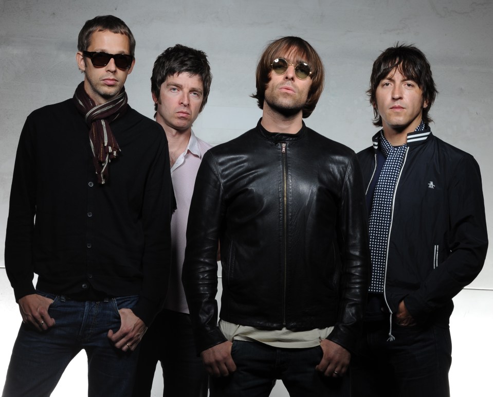 a group of men standing next to each other with one wearing sunglasses