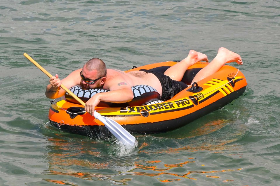 A holidaymaker paddles in the Channel at the Dorset resort town