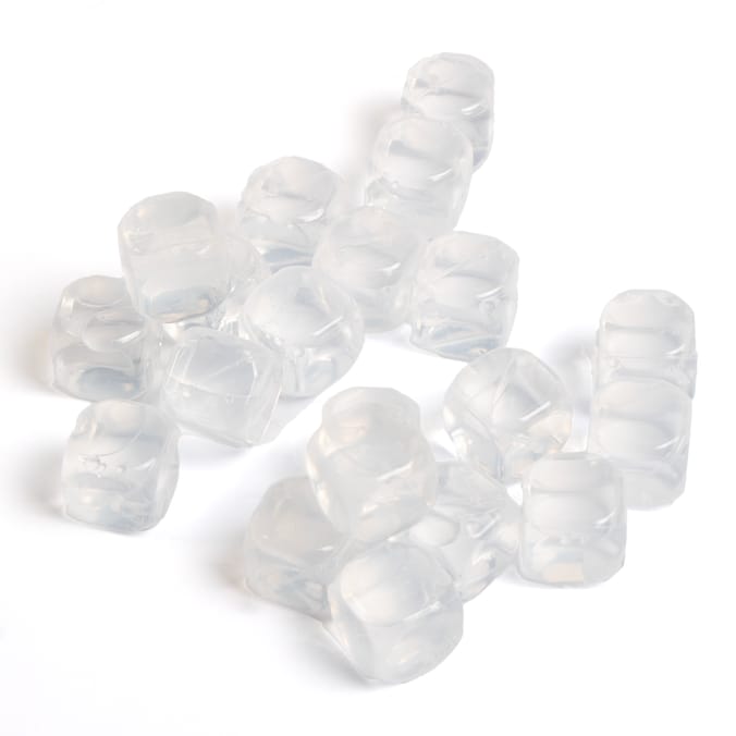 a bunch of clear ice cubes on a white surface