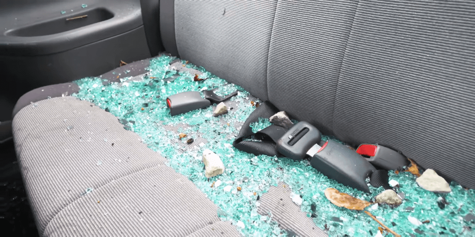 a car seat with a lot of broken glass on it