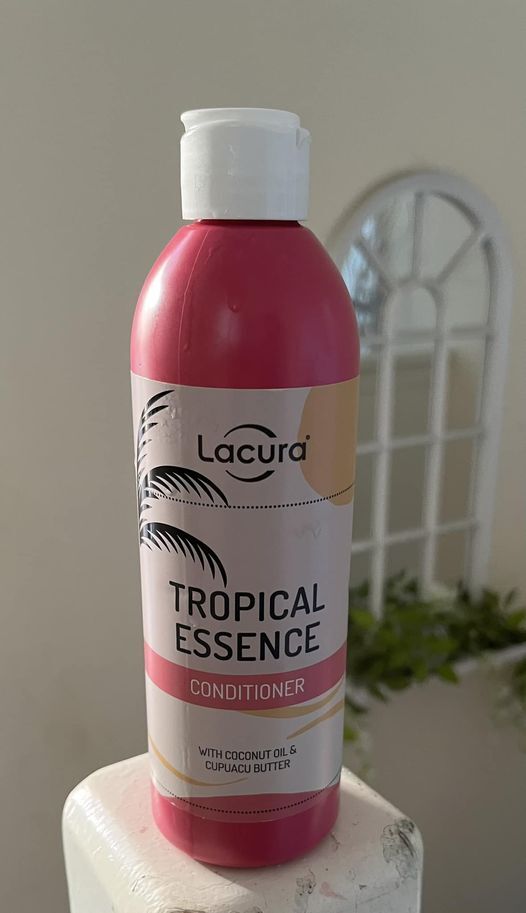 a pink bottle of lacura tropical essence conditioner