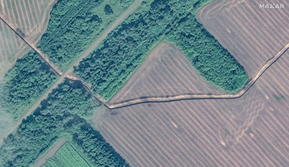 an aerial view of a landscape with the word maxar at the bottom