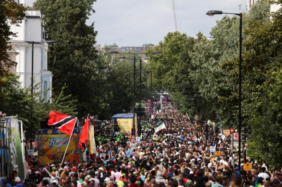 Revellers attend Notting Hill Carnival, in London