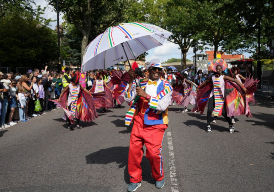 Kinetika Bloco taking part in the Children's Day Parade, part of the Notting Hill Carnival celebration in west London