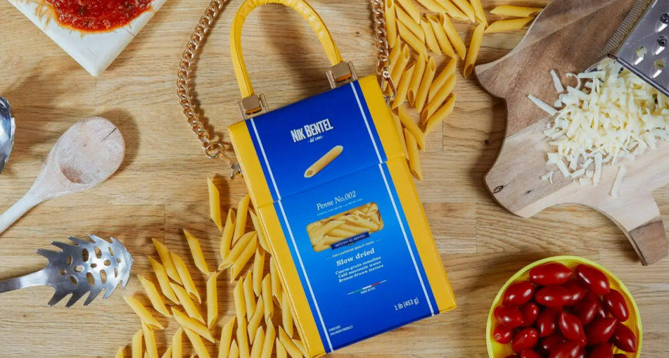 a box of penne no. 032 sits on a wooden table