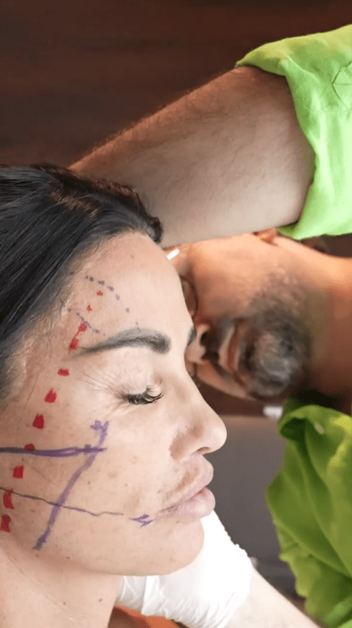 a woman with purple lines drawn on her face