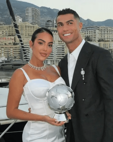 Georgina Rodriguez posed with Ronaldo and his award on a yacht