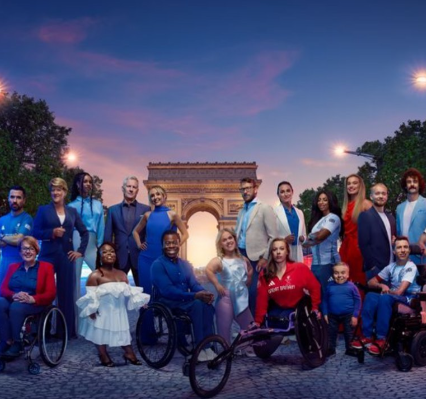 a group of people are posing for a picture with one wearing a shirt that says " great britain "