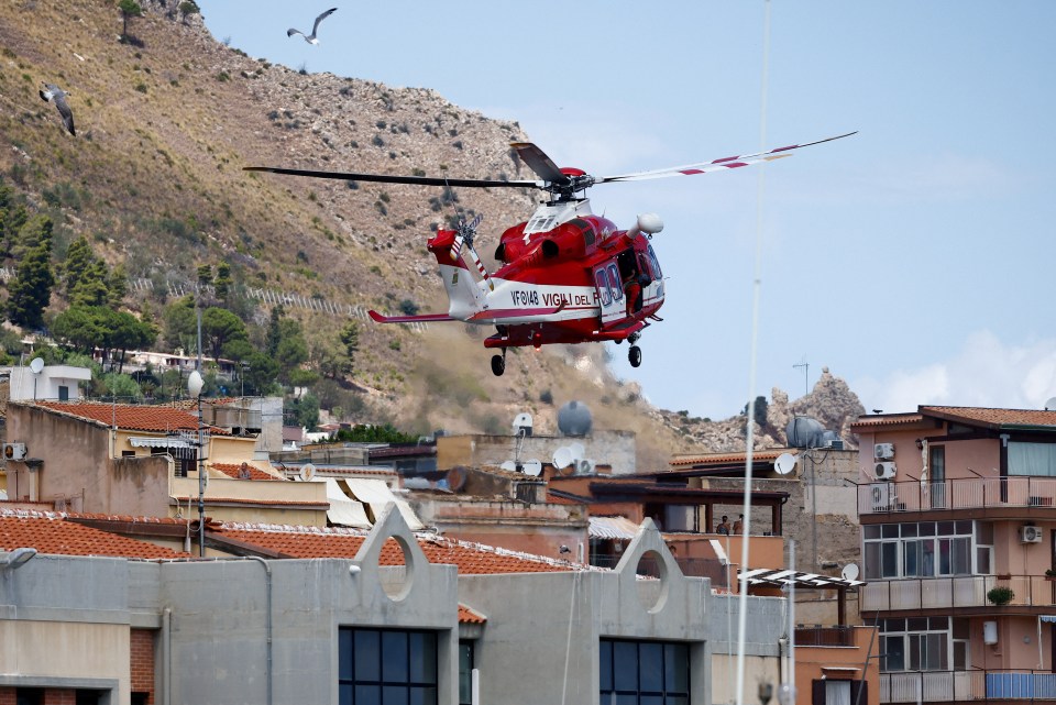 A helicopter heads out to help in the search for the missing on Wednesday