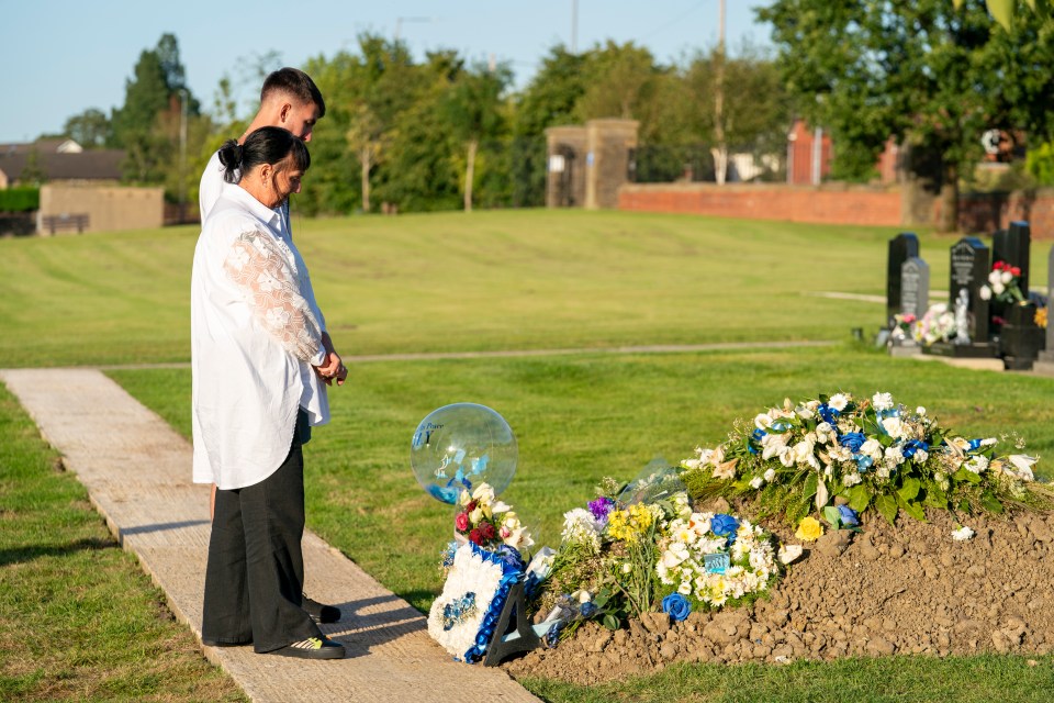 Jay's devastated mum Debbie and brother Zak at his grave