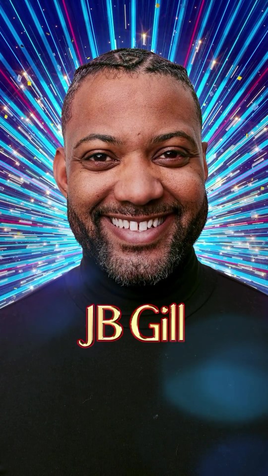 a man with a beard and the name jb gill is smiling