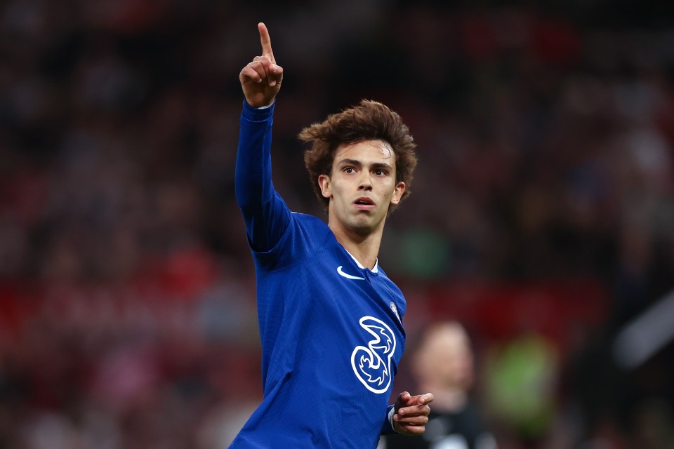 a soccer player wearing a blue shirt with the number 3 on it