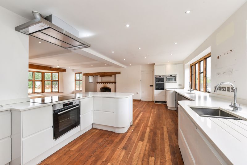 The kitchen has been tidied up – but there are marks on the wall where cupboards have been ripped out