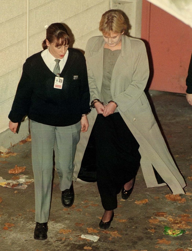 a woman wearing a badge that says ' security ' on it