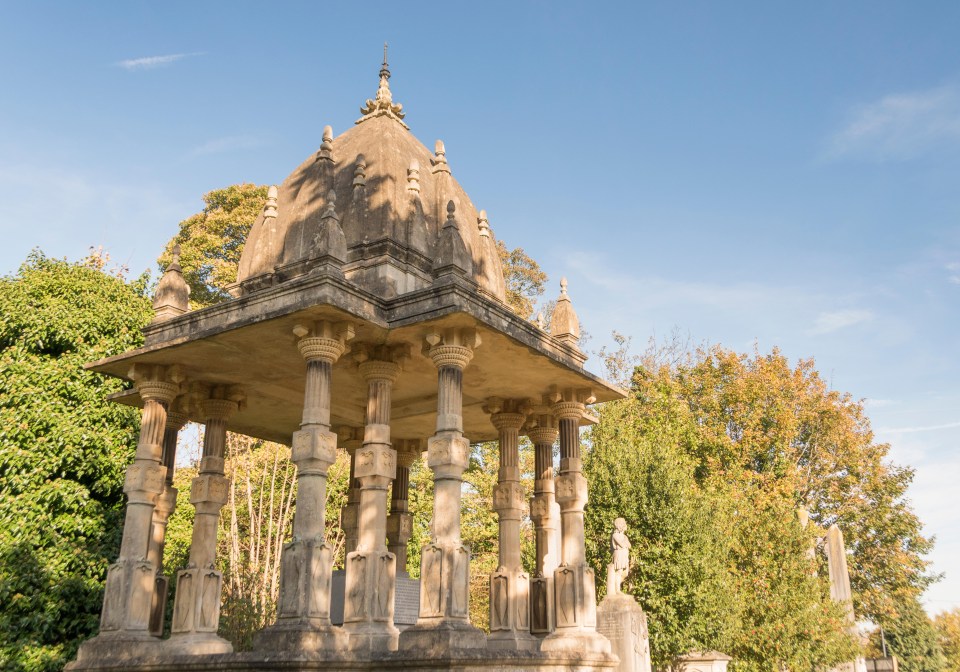 a stone structure with a blue sky in the background