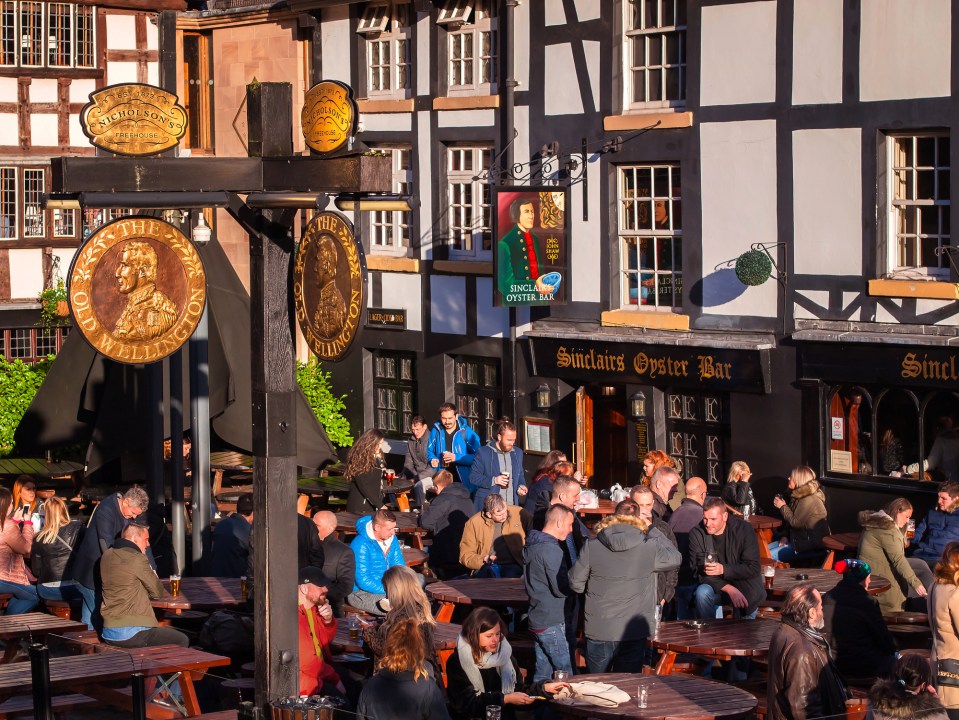 a group of people are gathered outside a pub called smith 's oyster bar